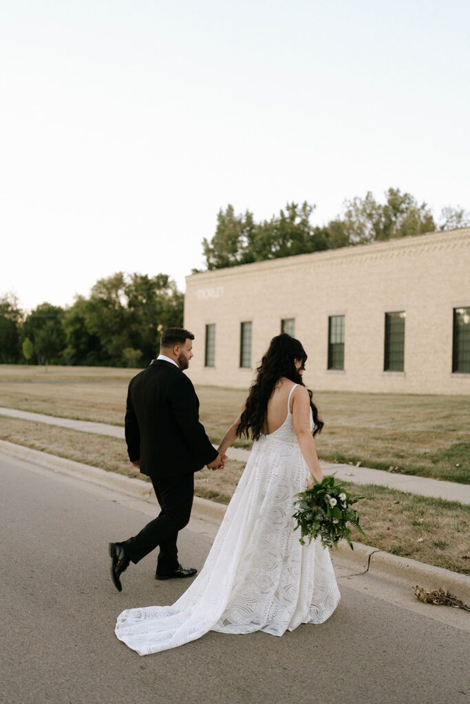 cute couple walking around their dream wedding venue 