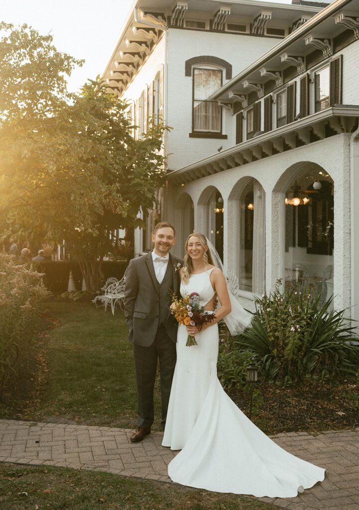 cute couple smiling at the camera during their bridal portraits