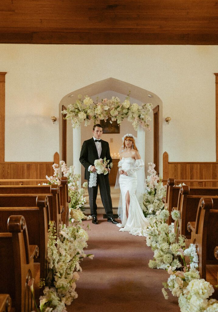 cute couple holding hands at the altar 