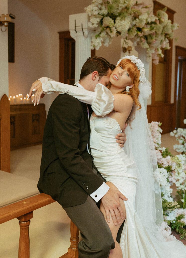groom kissing the bride on the neck