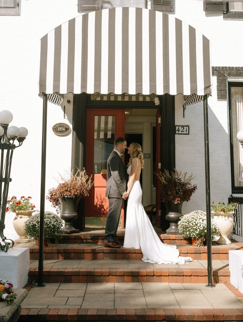 cute picture of the bride and groom kissing during their photoshoot