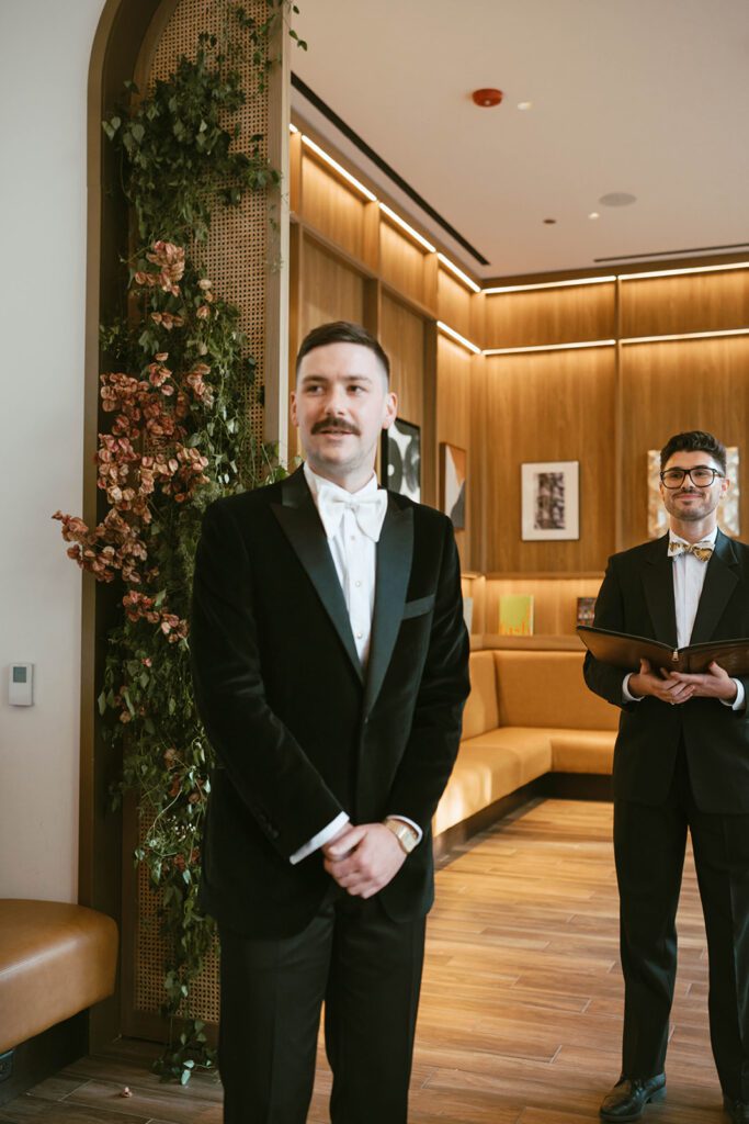 groom emotional watching the bride walk down the aisle