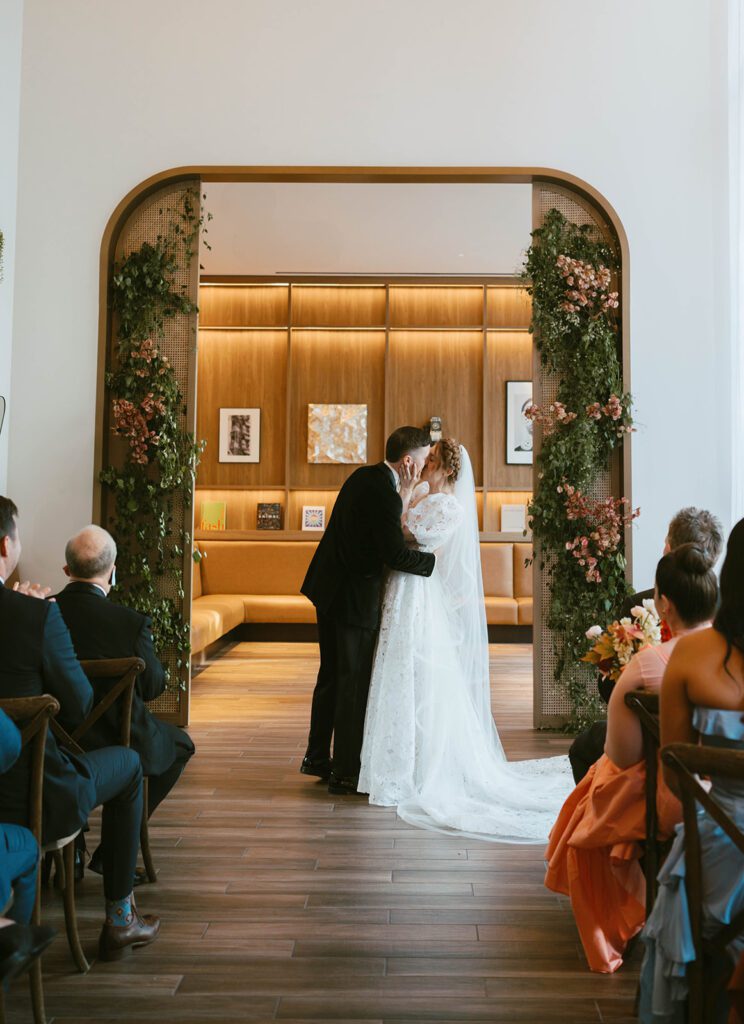 bride and groom kissing after their ceremony
