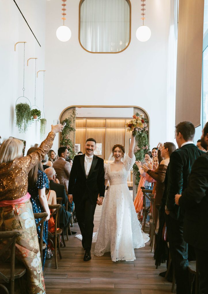 newlyweds heading to their wedding reception party