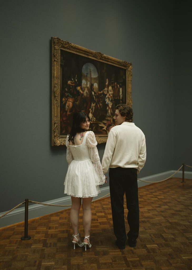 Couple smiling at each other during their photoshoot