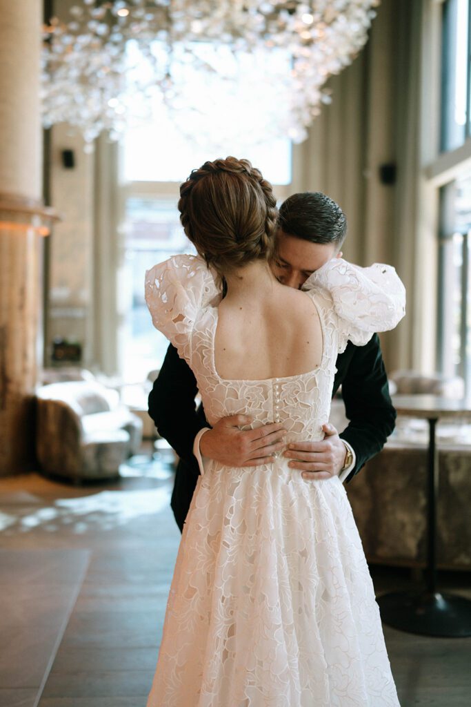 bride and groom hugging after their first look