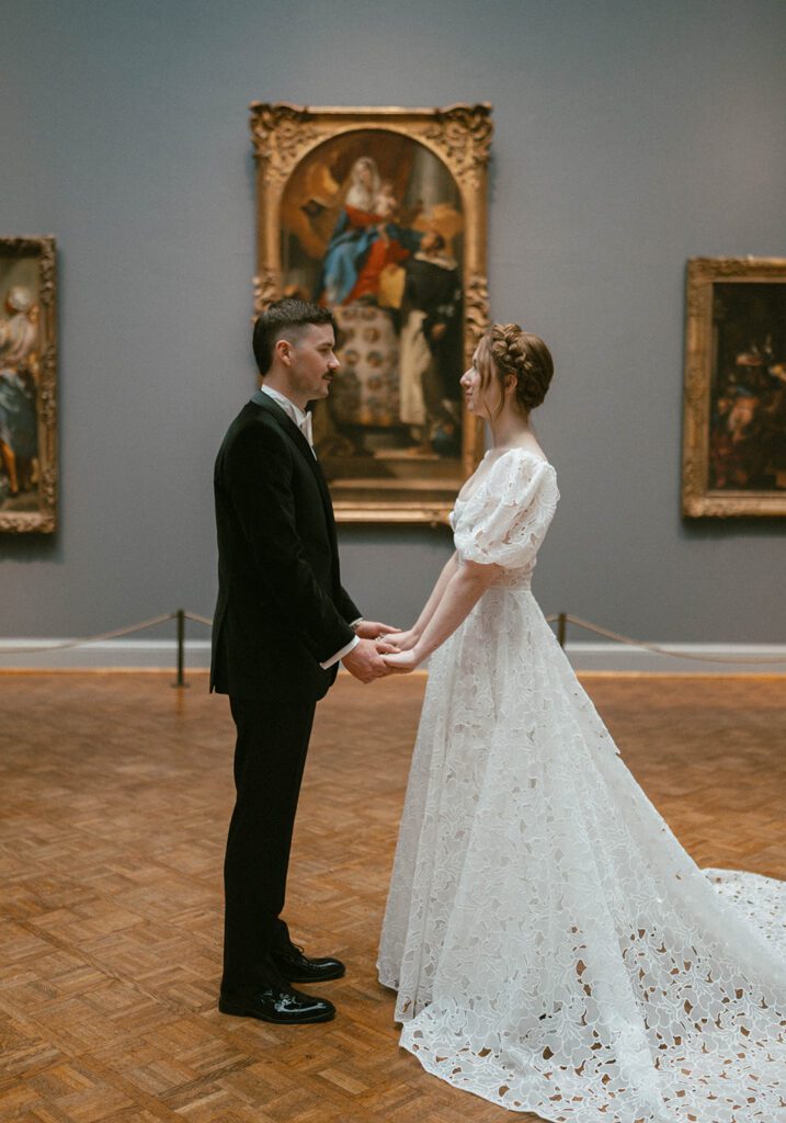 portrait of the bride and groom smiling at each other