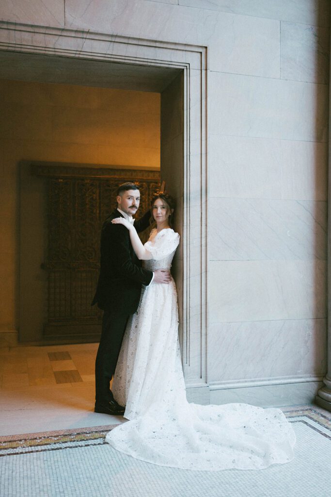 couple posing for the camera during their photoshoot