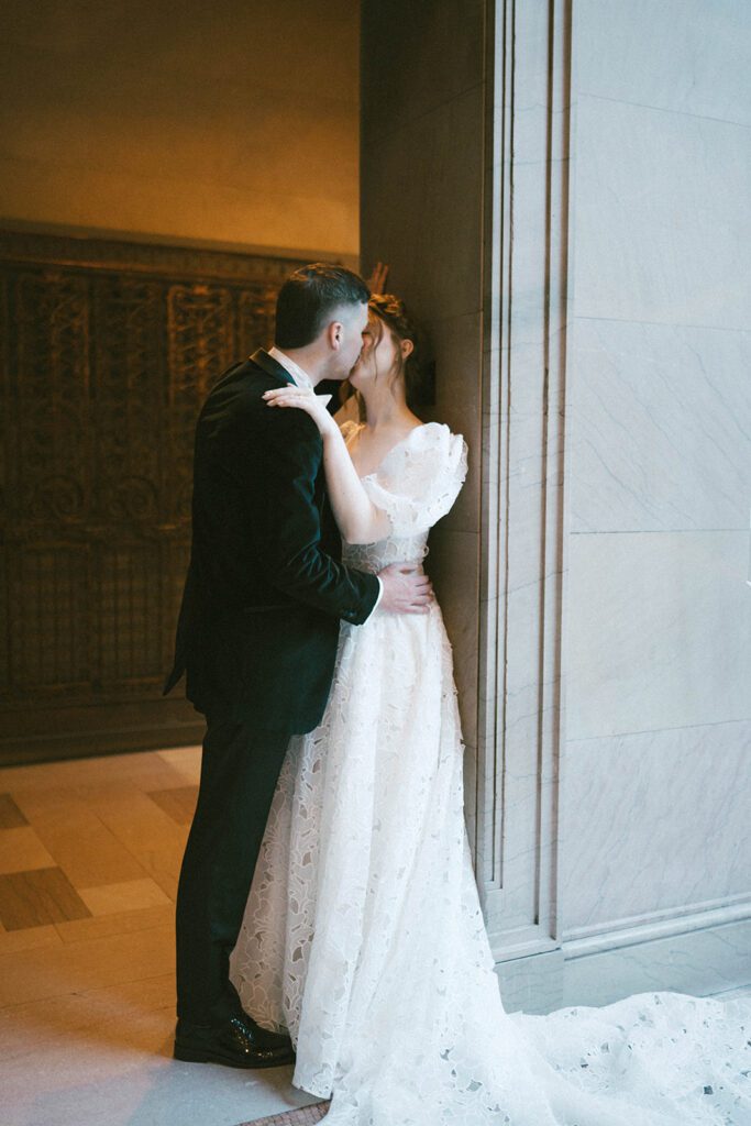 picture of the bride and groom kissing at their bridal photos