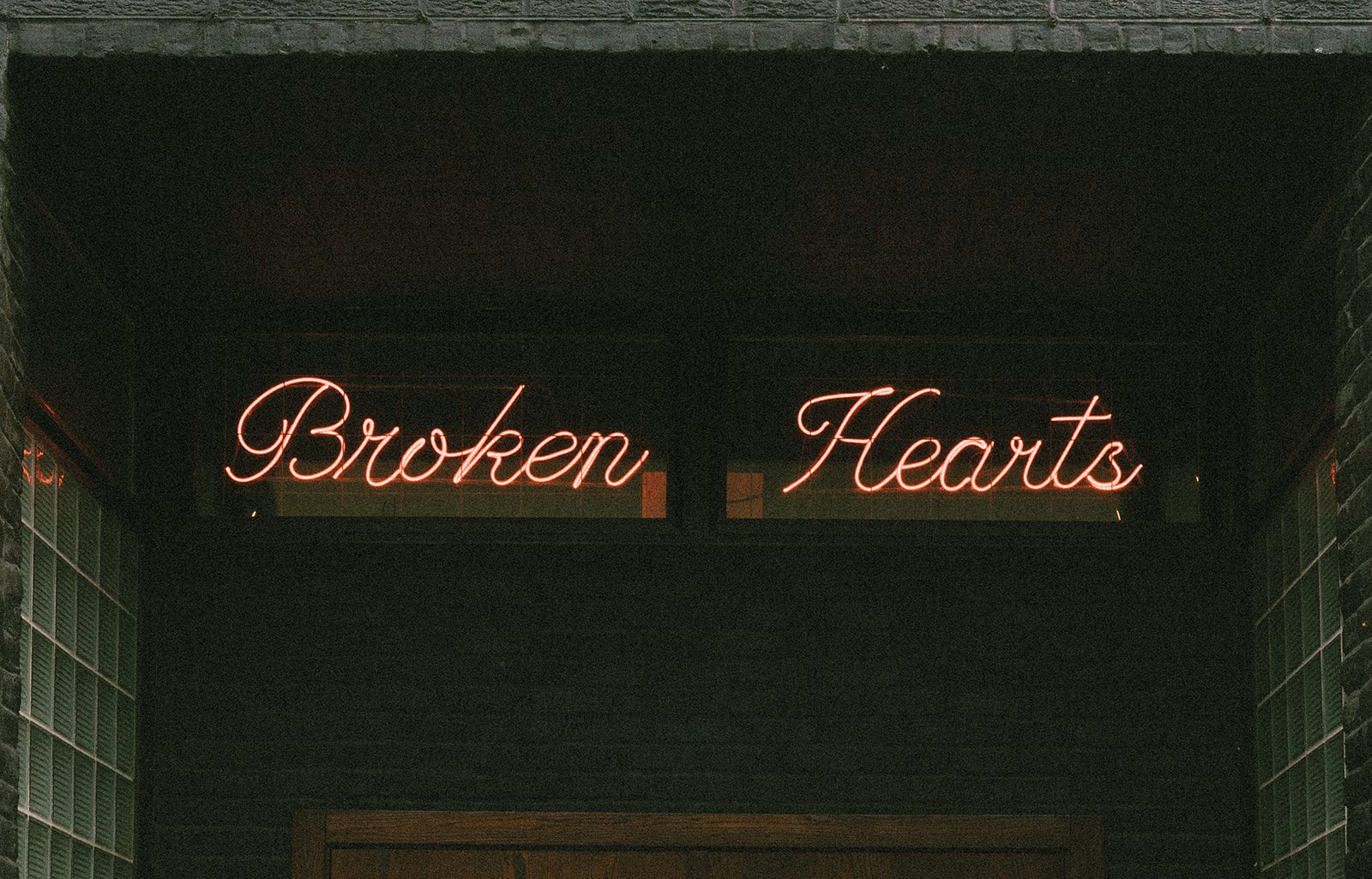 A neon sign at Broken Hearts Chicago