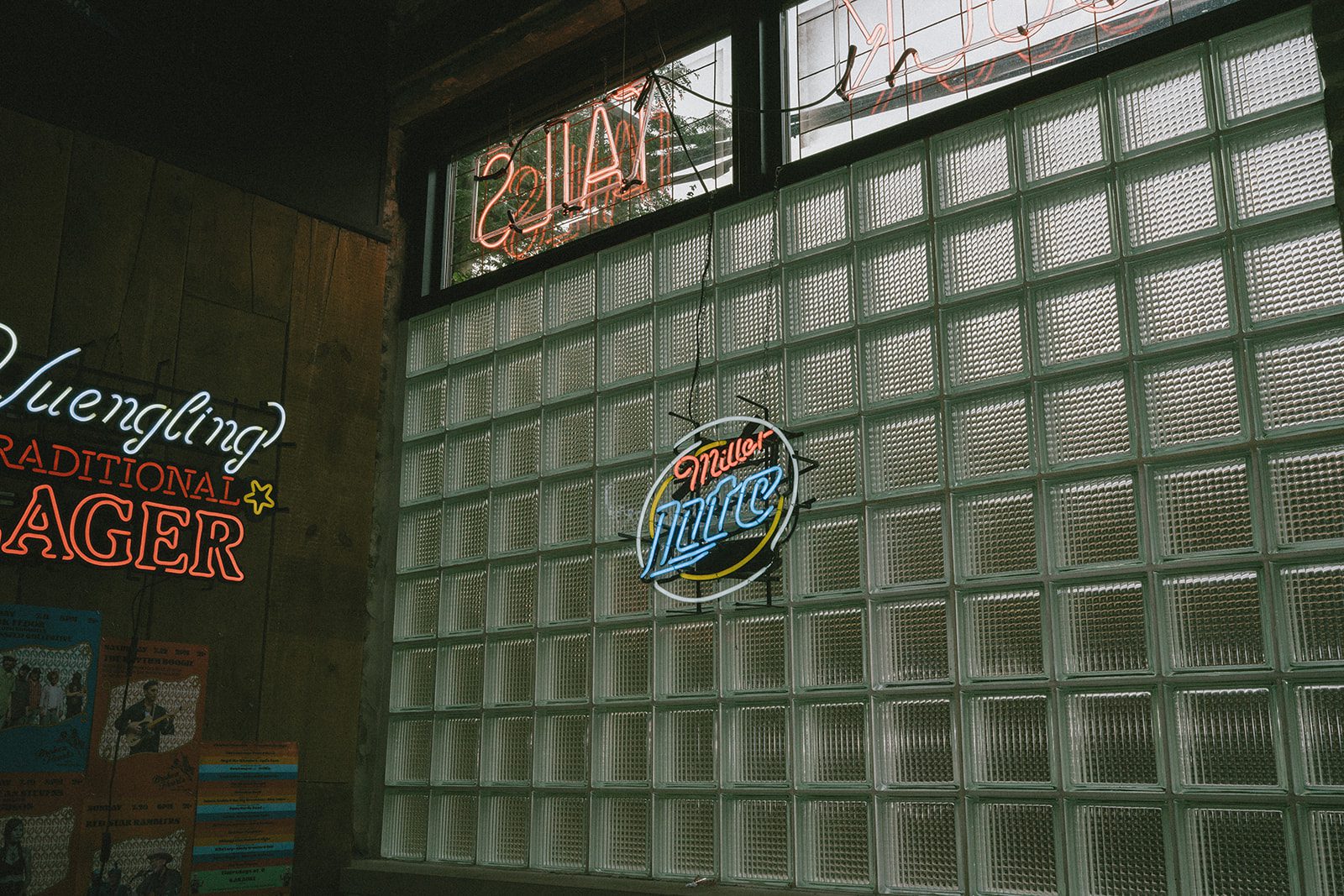 A neon Miller Lite sign inside of Broken Hearts in Chicago