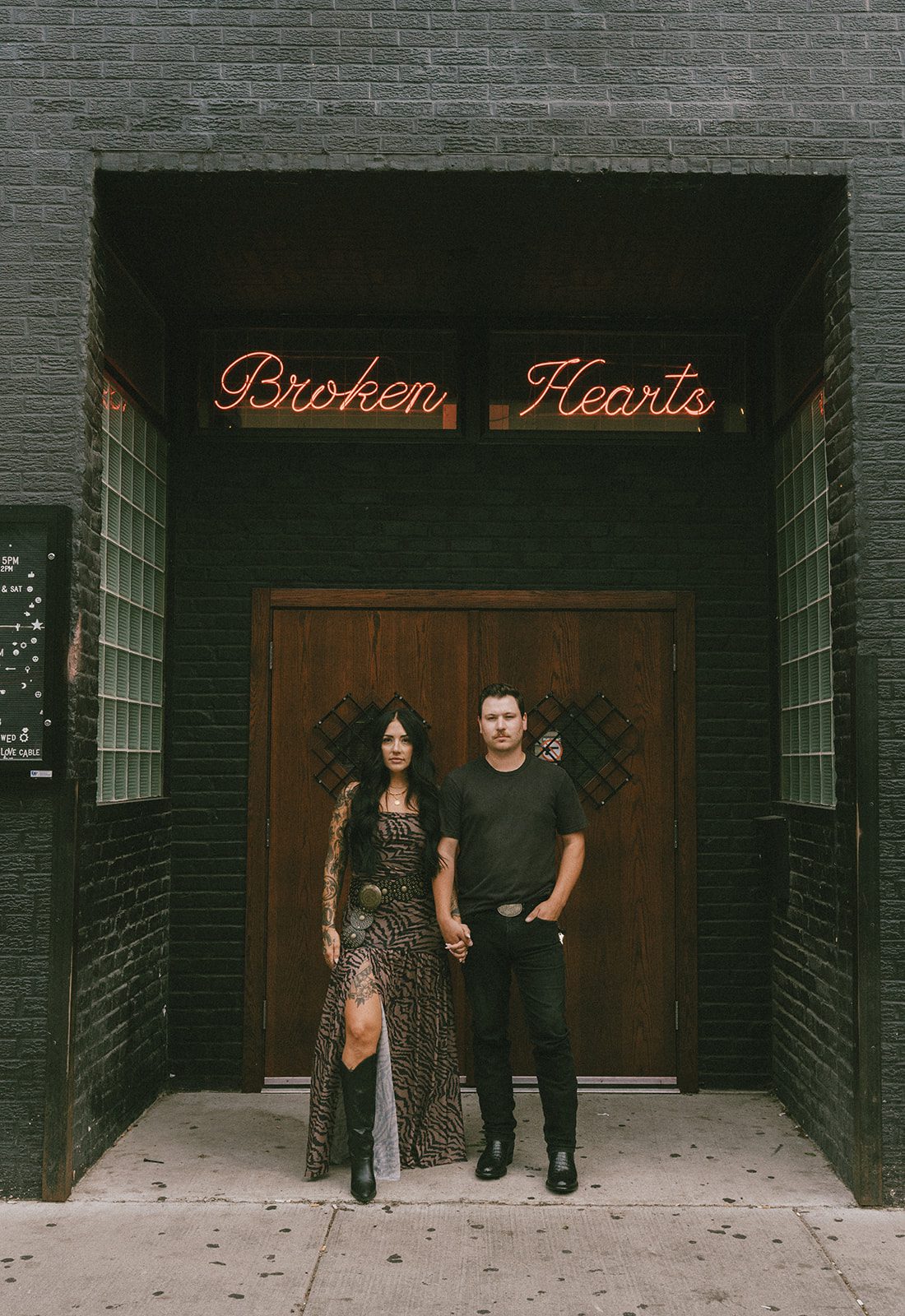 A couple standing outside of Broken Hearts Chicago