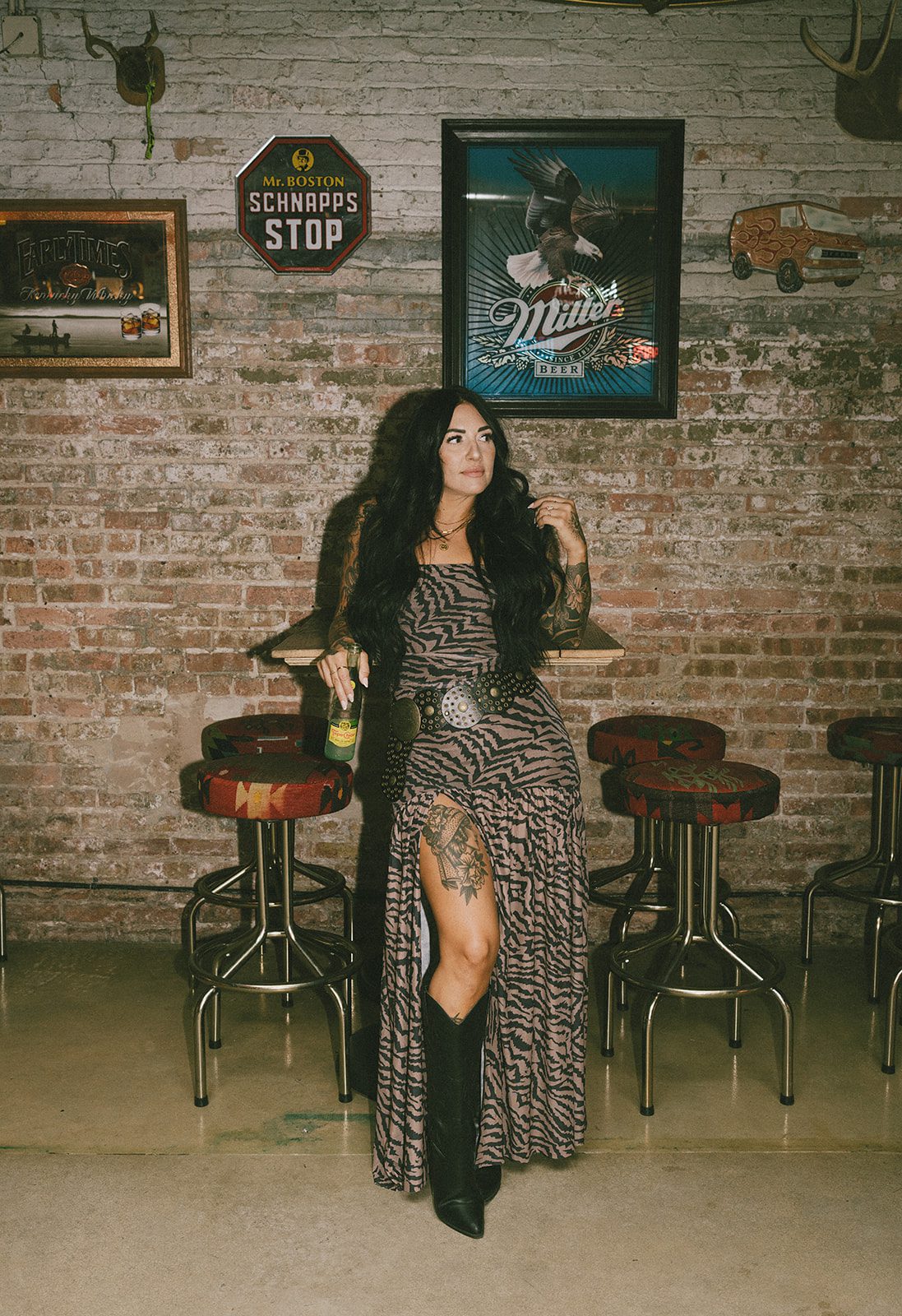 A girl wearing a tiger print dress for a couples photshoot