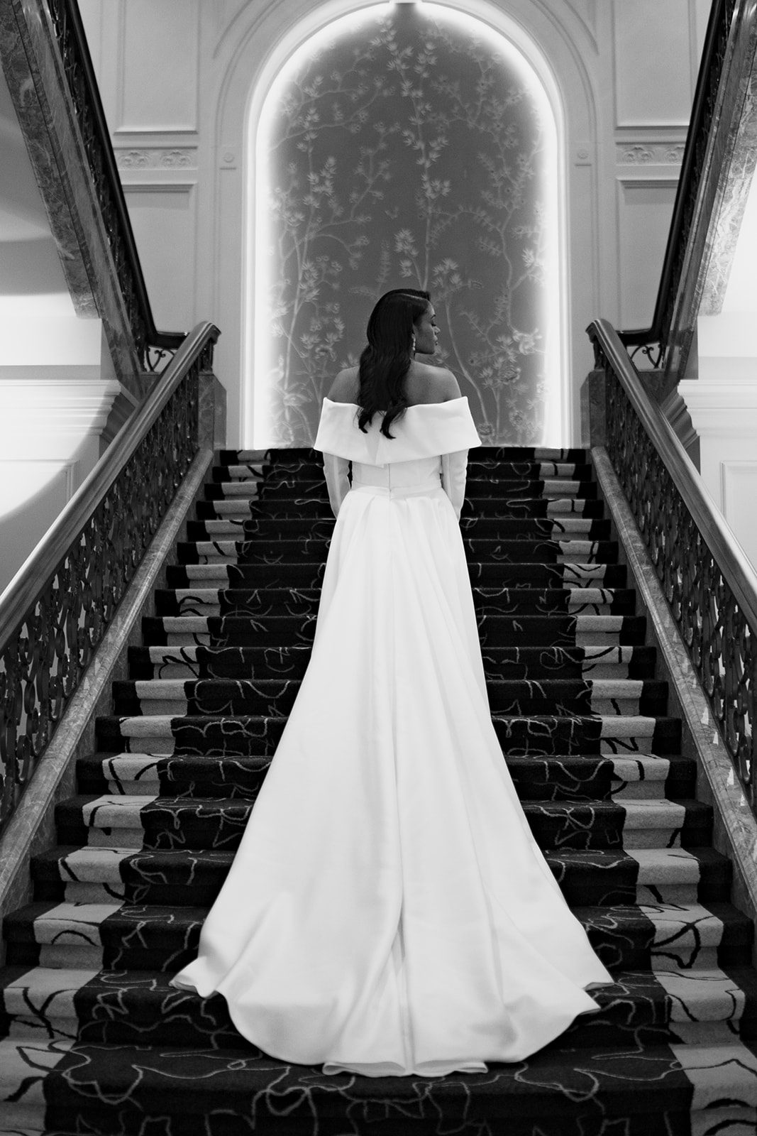 The back of a bride's wedding dress on stairsteps at a Chicago hotel