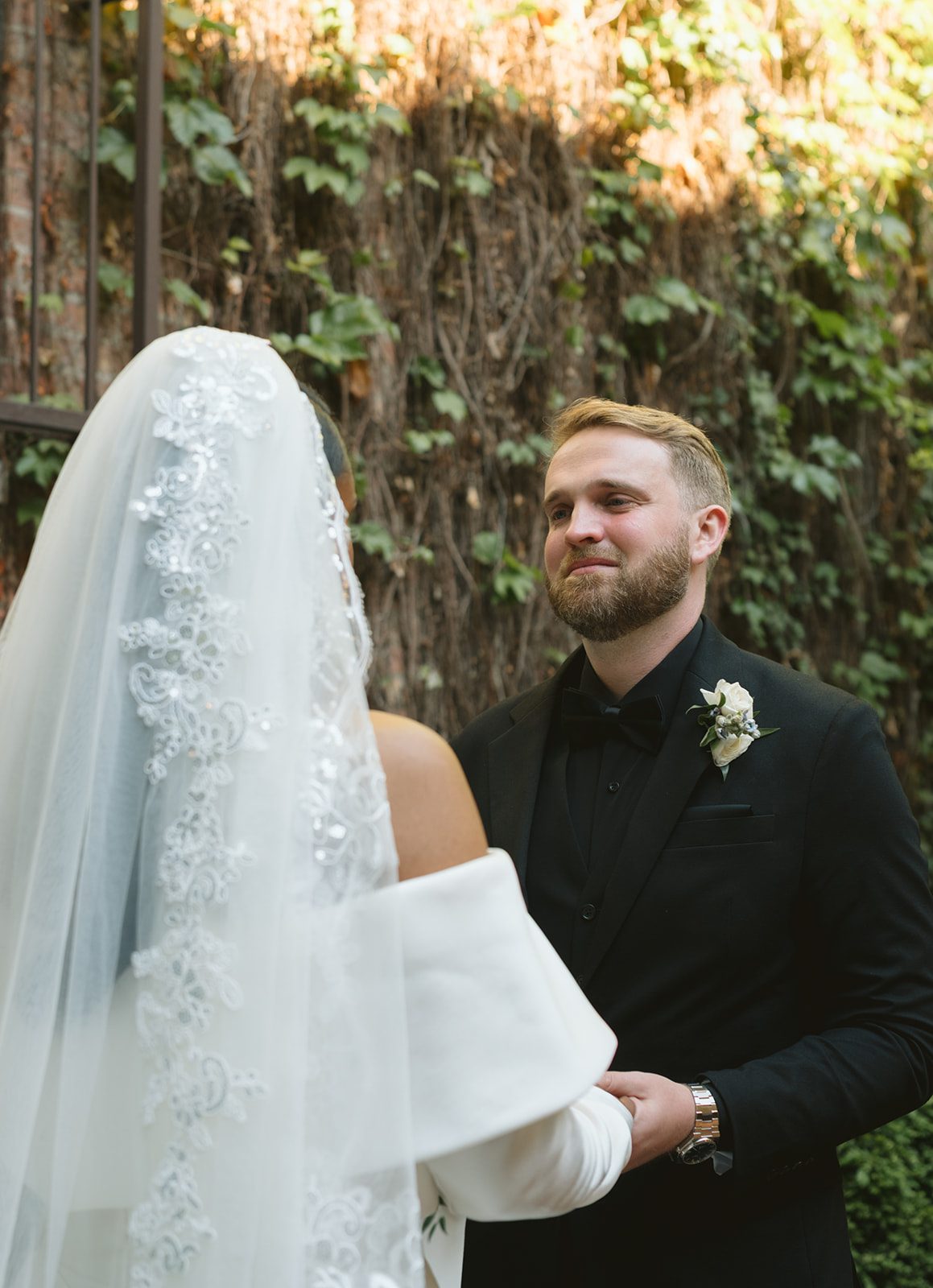 A bride and groom during their wedding ceremony at the ivy room