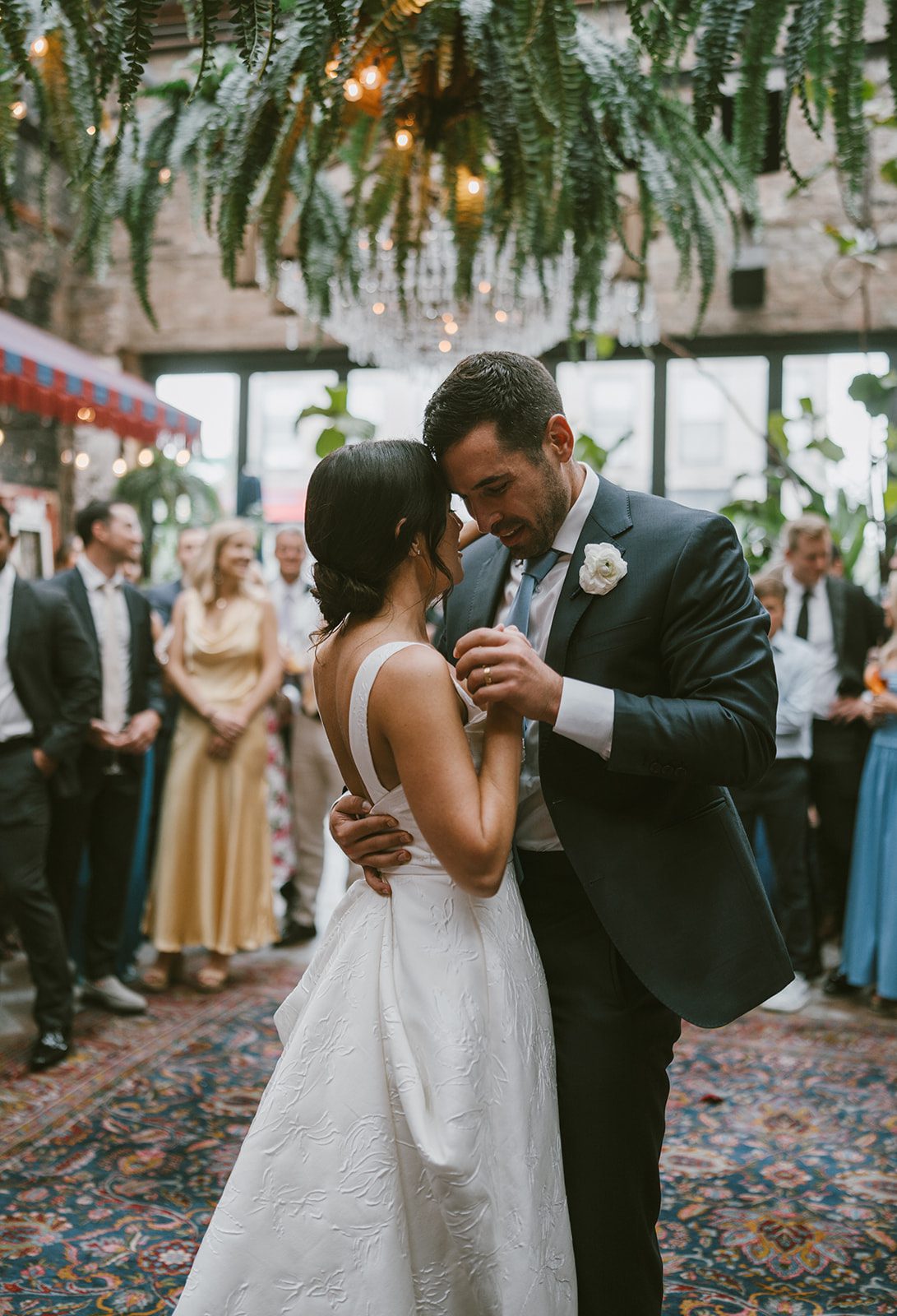 A bride and groom dancing at their Beatnik West Town wedding reception