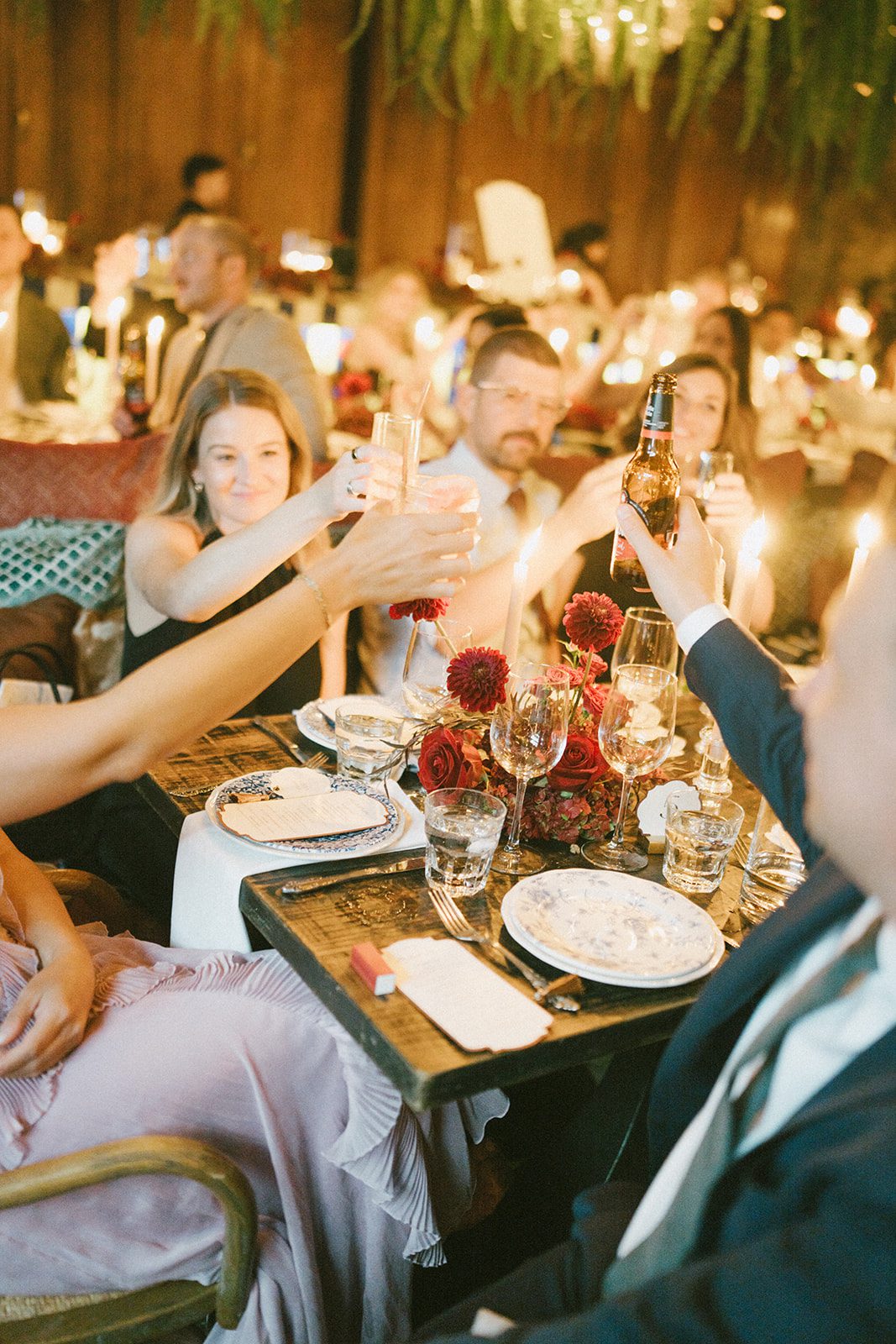 Guests clinking glasses at a restaurant wedding reception
