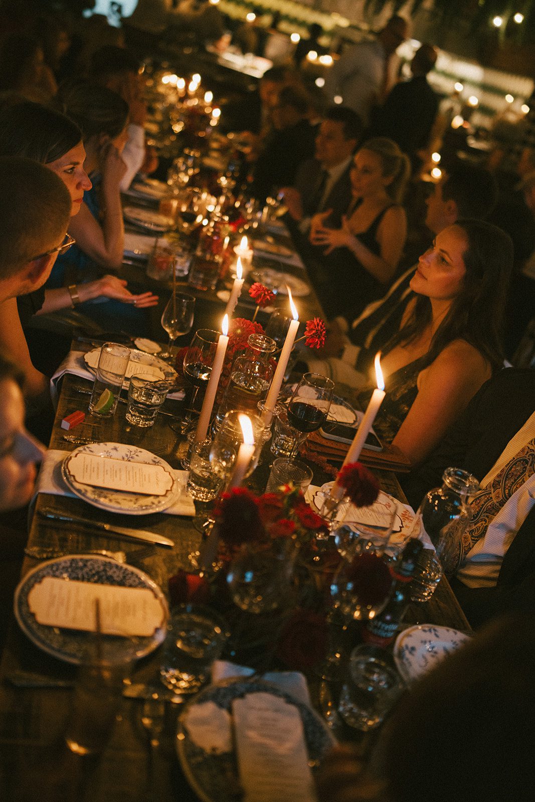 A restaurant wedding reception with guests at a table