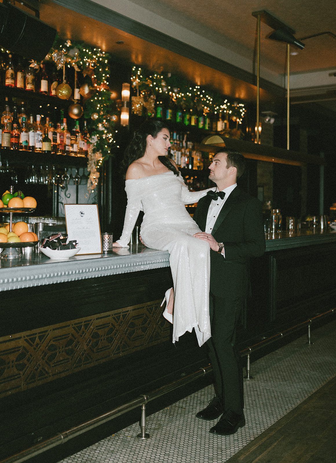 A bride and groom in the whiskey bar at celeste chicago