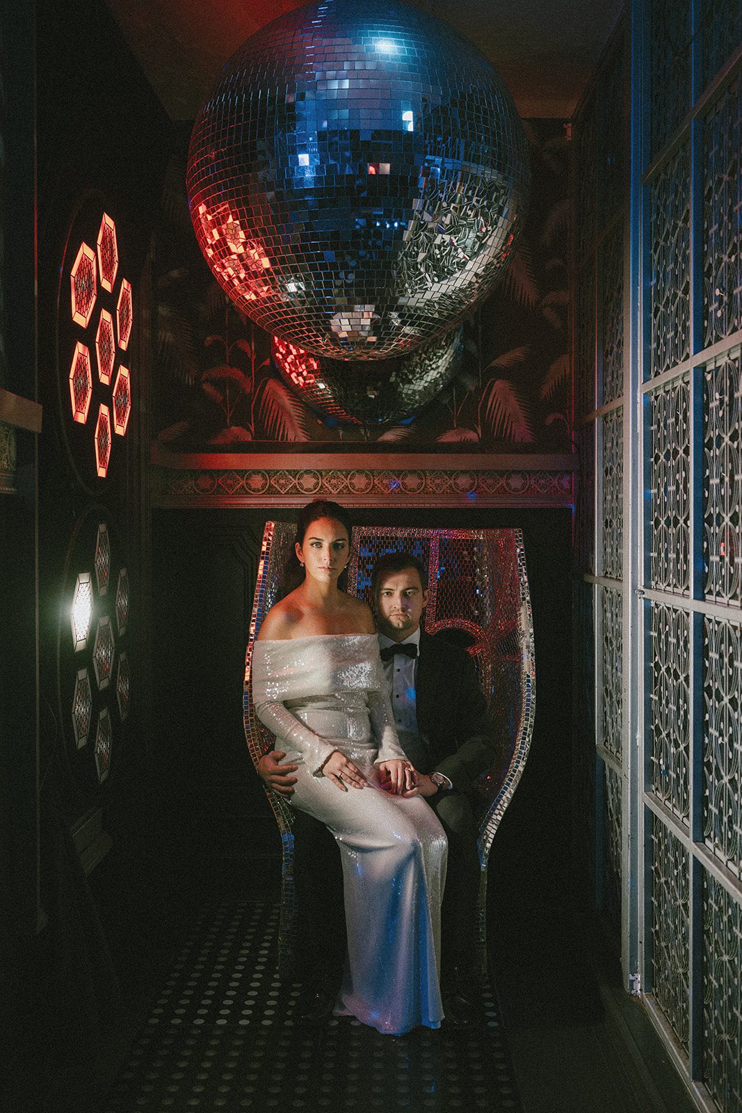 A bride and groom sitting in a disco chair at celeste chicago