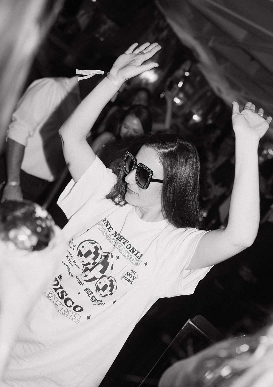 A wedding guest wearing the t shirt they caught