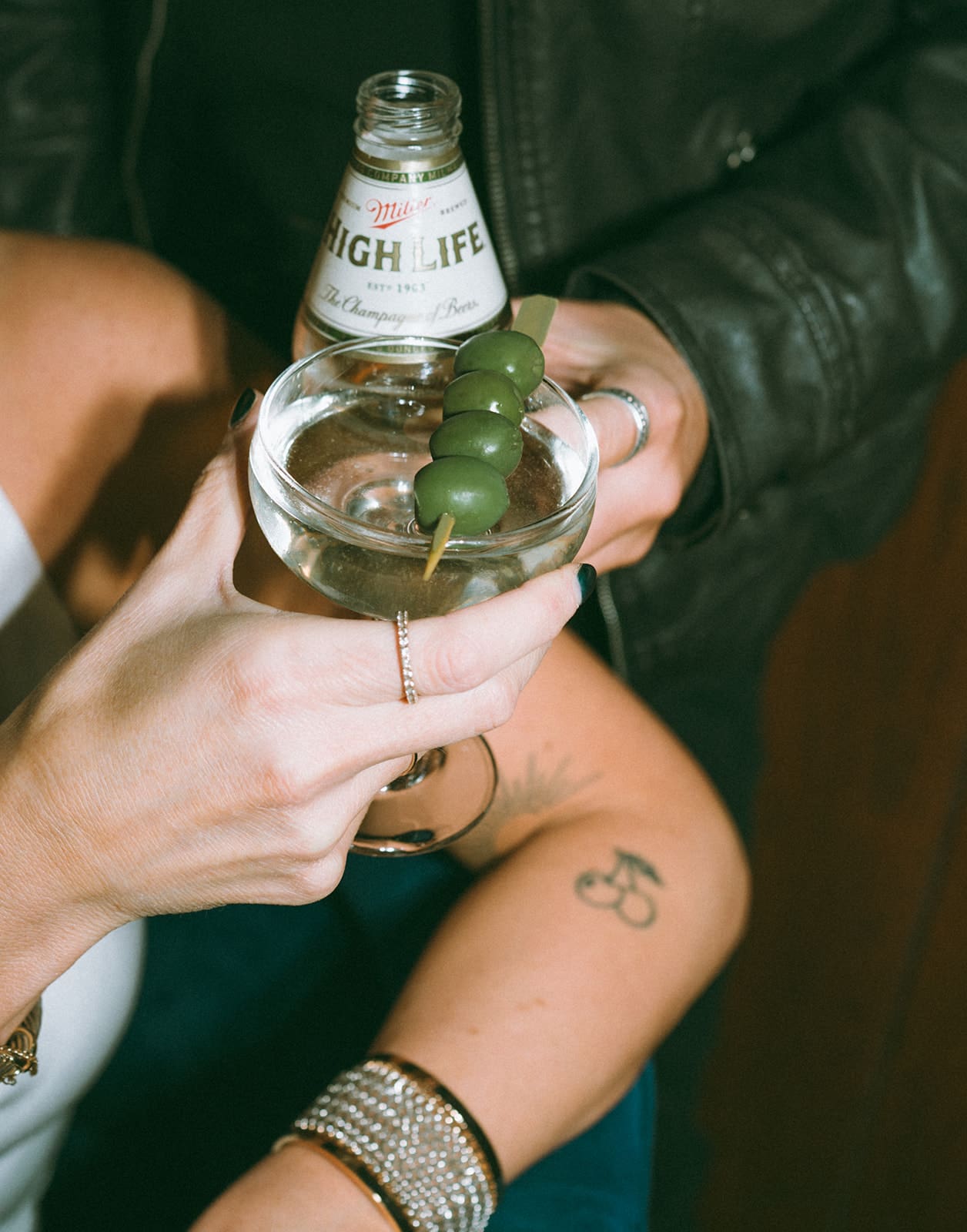 A couple clinking drinks as an engagement photoshoot idea