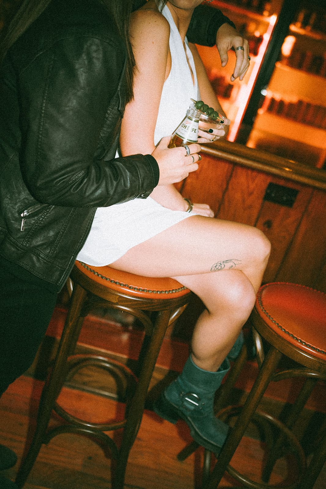 A couple posing for bar engagement photos