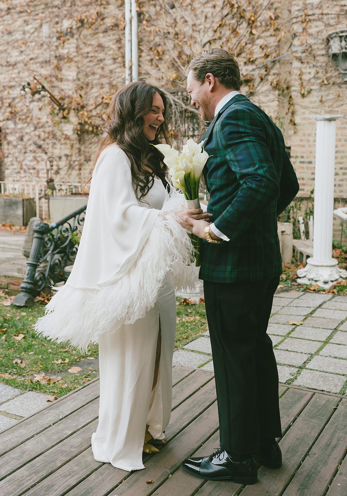 A bride and groom laughing during a first look