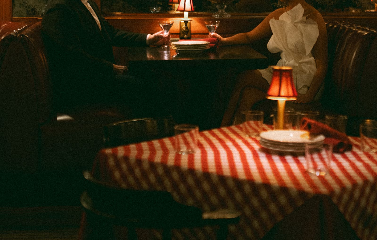 A couple in a booth at Trivoli Tavern for engagement photos