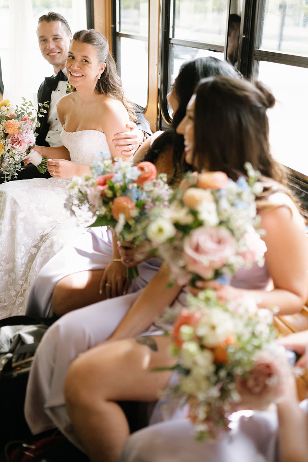 A bridal party on the way to take wedding party photos via trolley