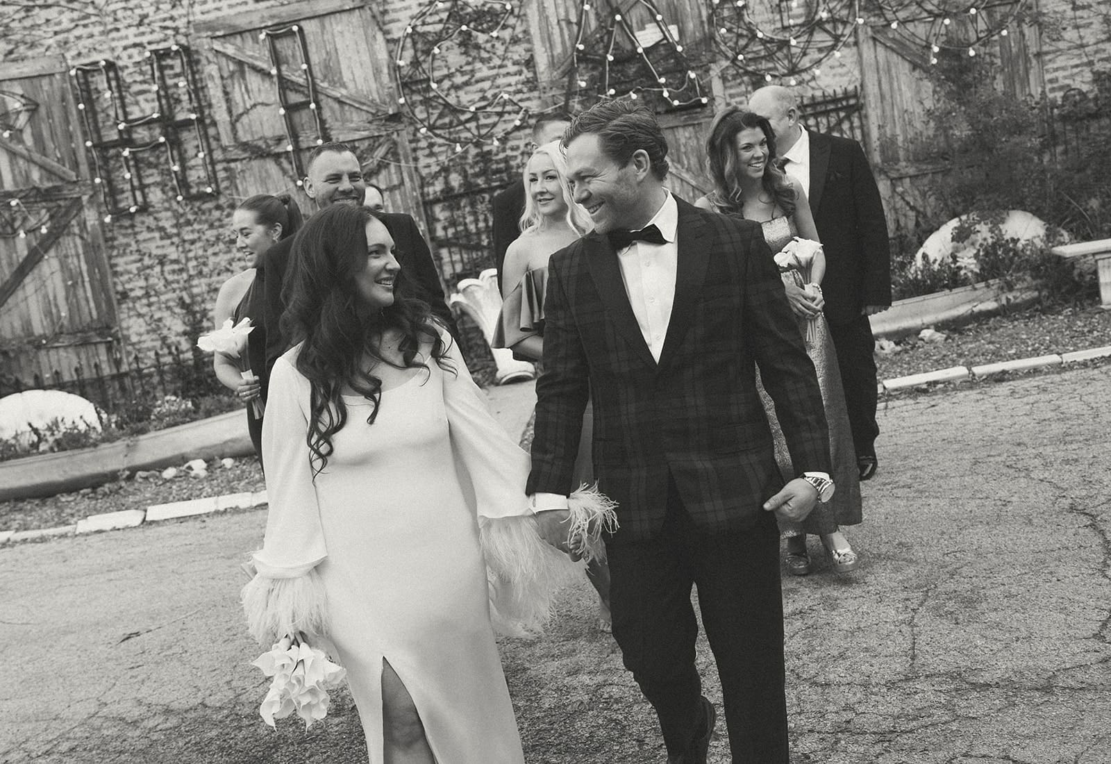 A wedding party walking towards the camera during photos