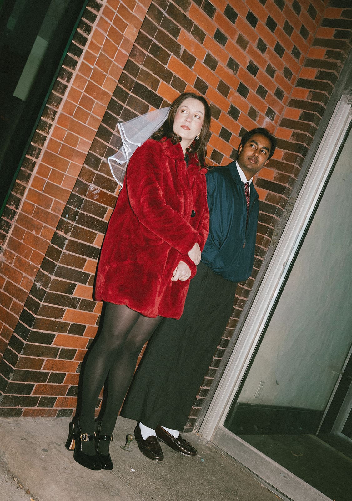 A couple showing what to wear for engagement photos in the winter