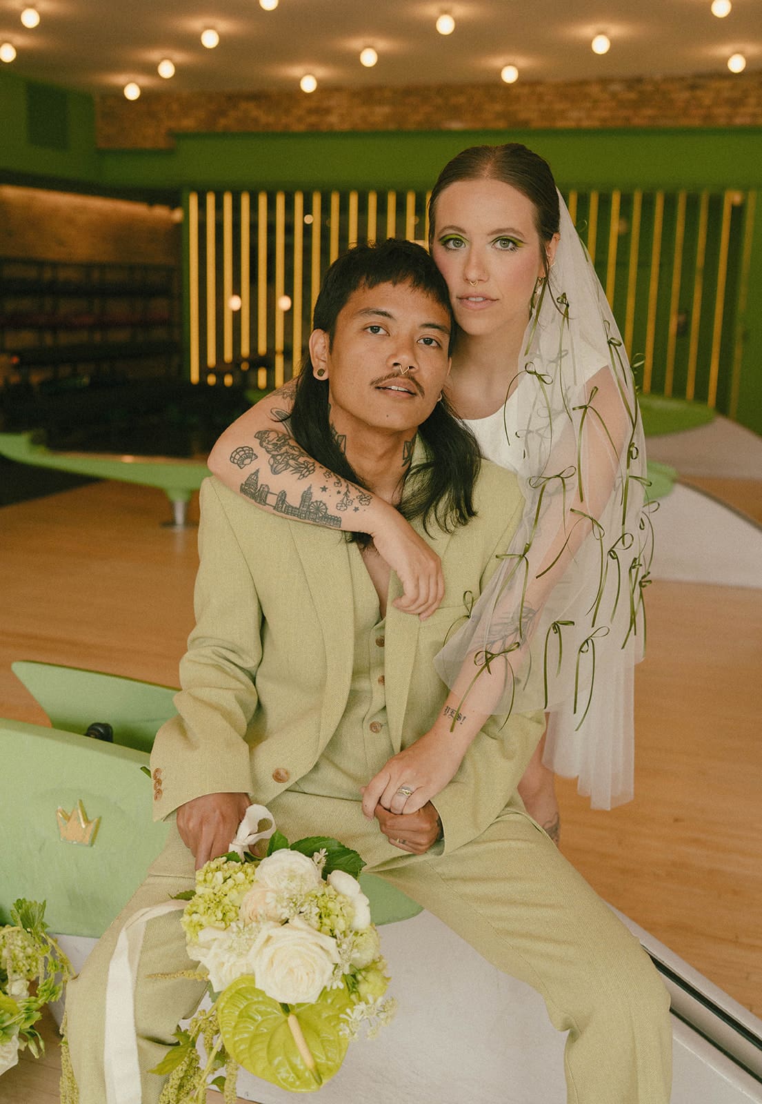 A couple posing for engagement photos and showcasing what to wear for engagement photos