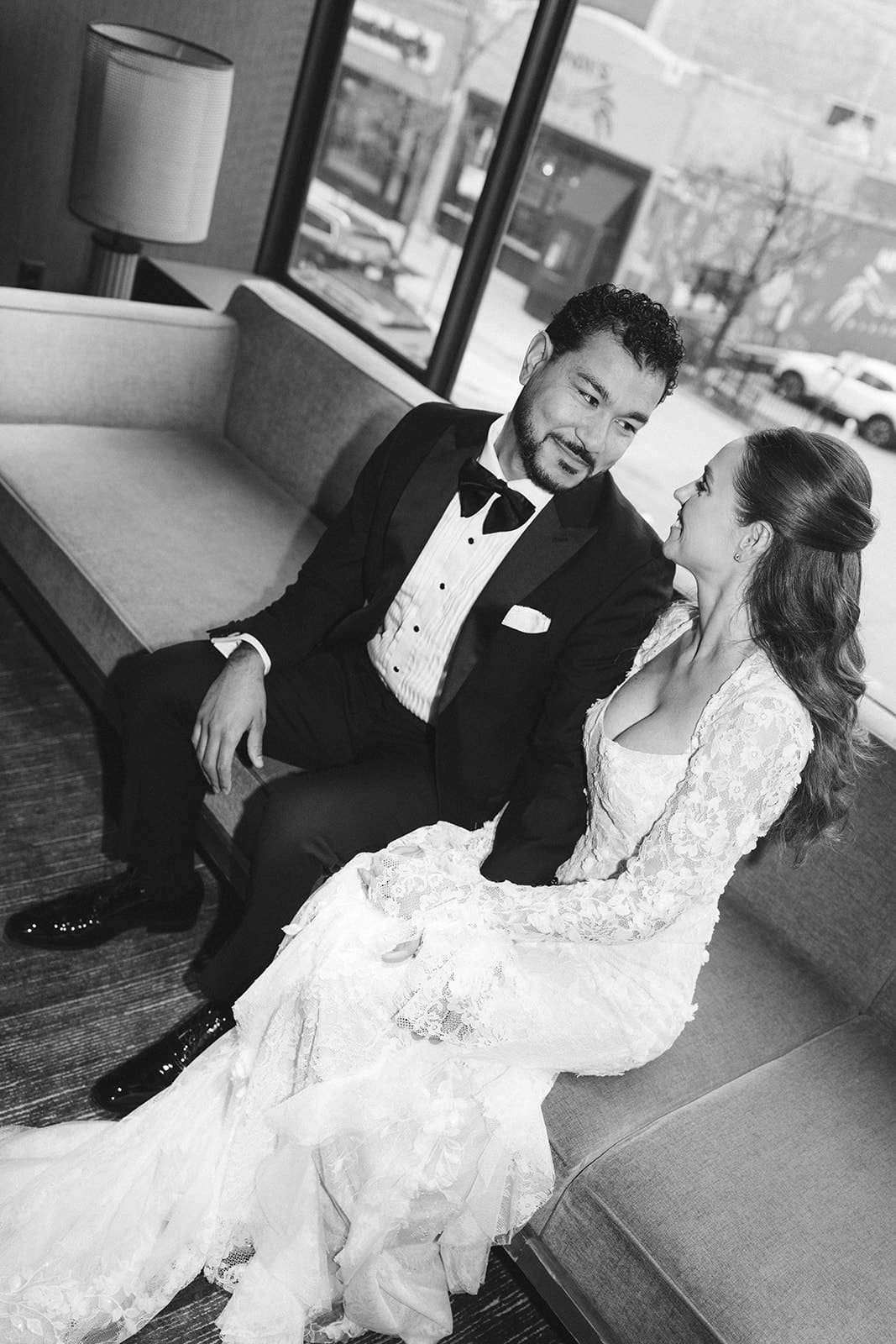 A black and white photo of a bride and groom on their wedding day