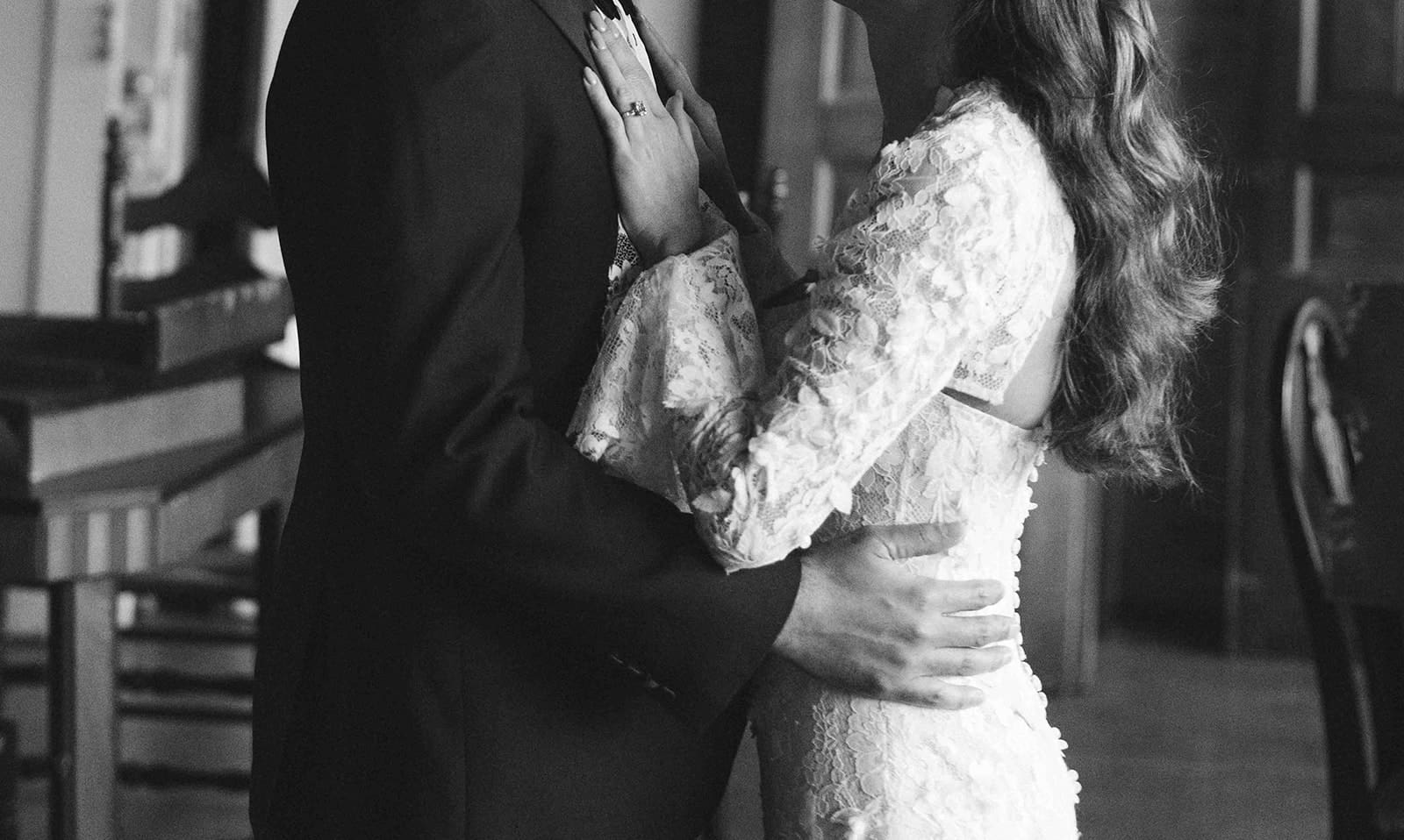 A bride and groom posing for wedding photos on their wedding day