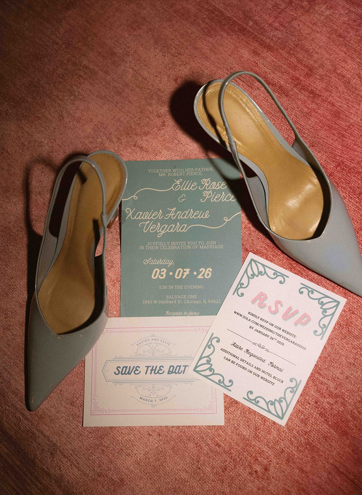 A wedding flat lay with blue and pink wedding details