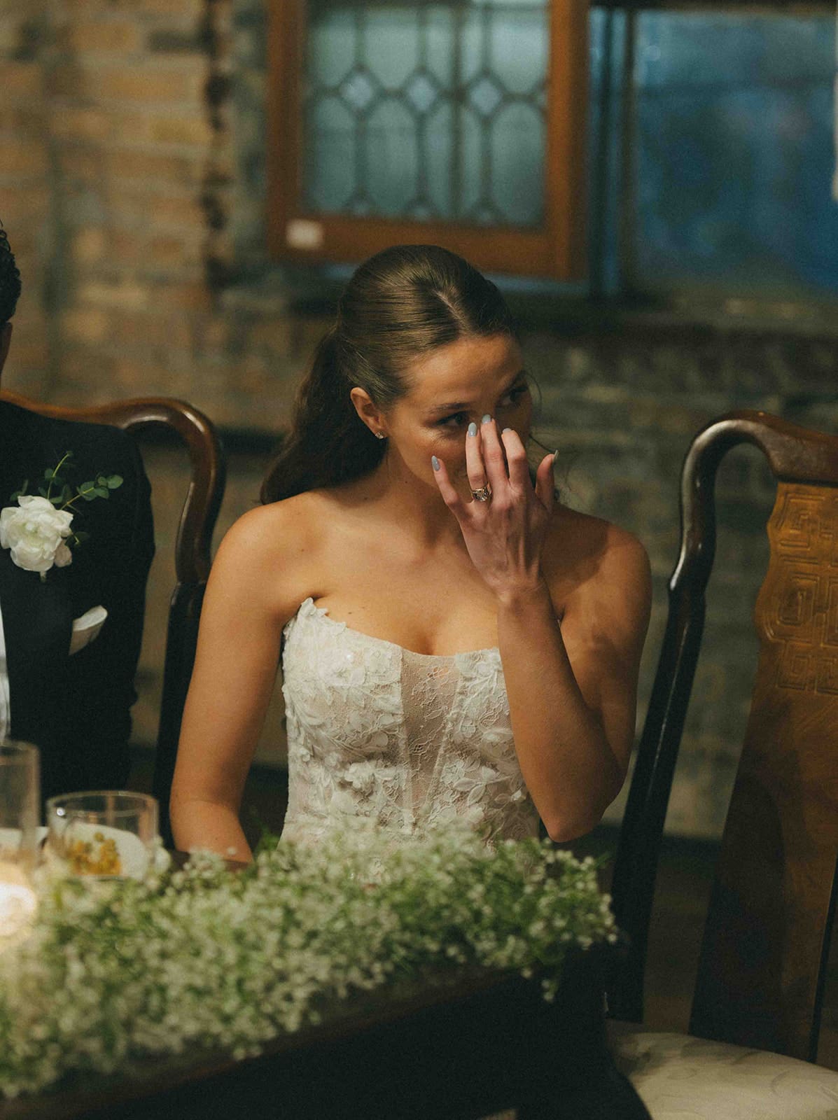 A bride crying during toasts