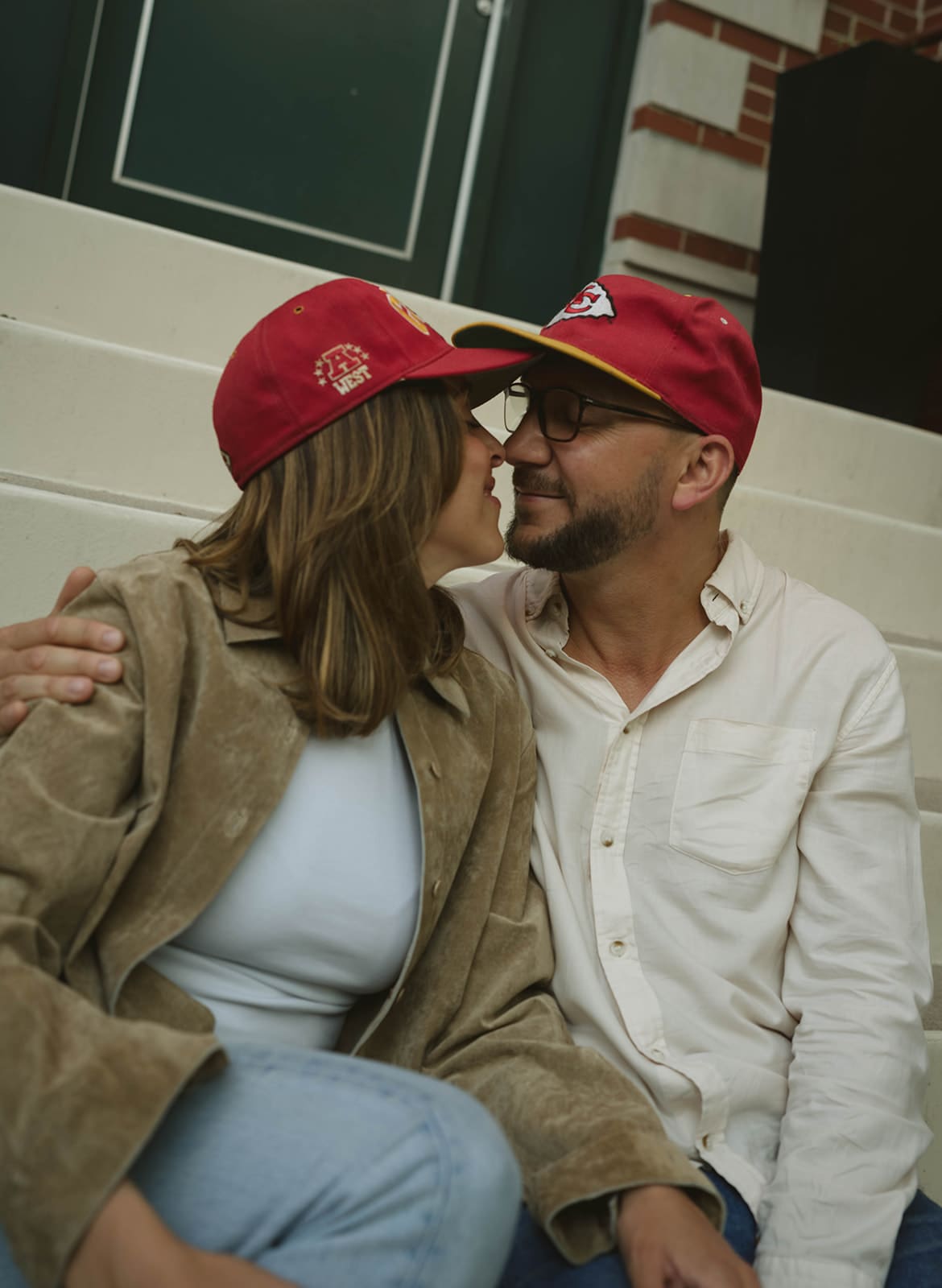 A couple leaning in for a kiss during engagement photos