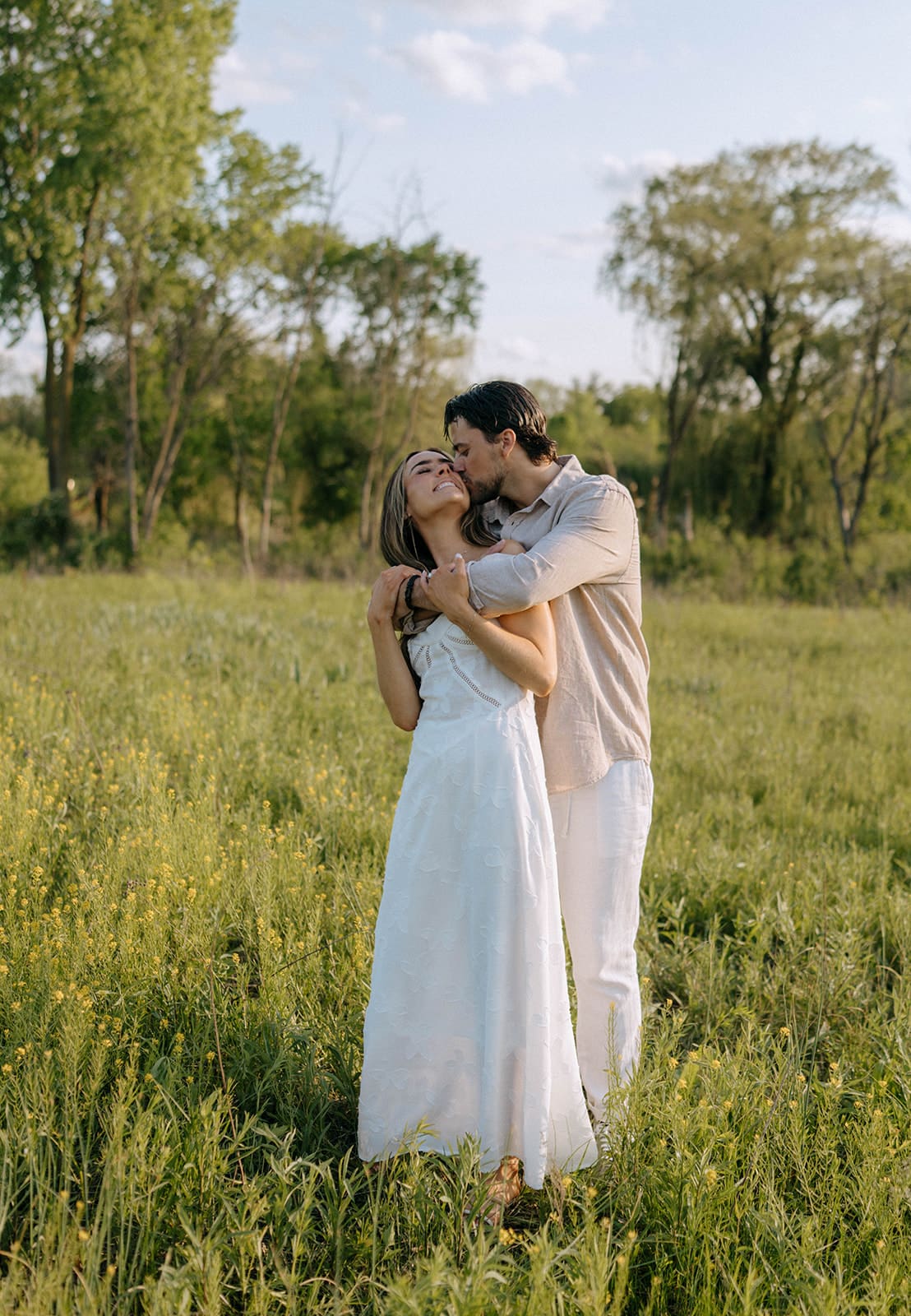 A couple posing for their outdoor engagement photoshoot