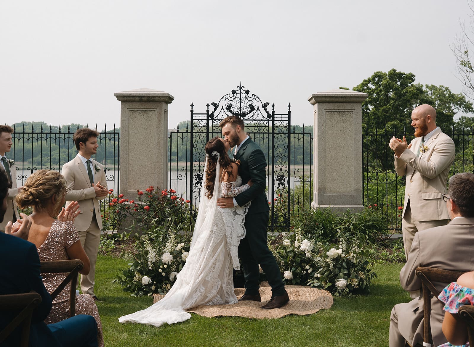 A bride and groom's first kiss during their wedding ceremony