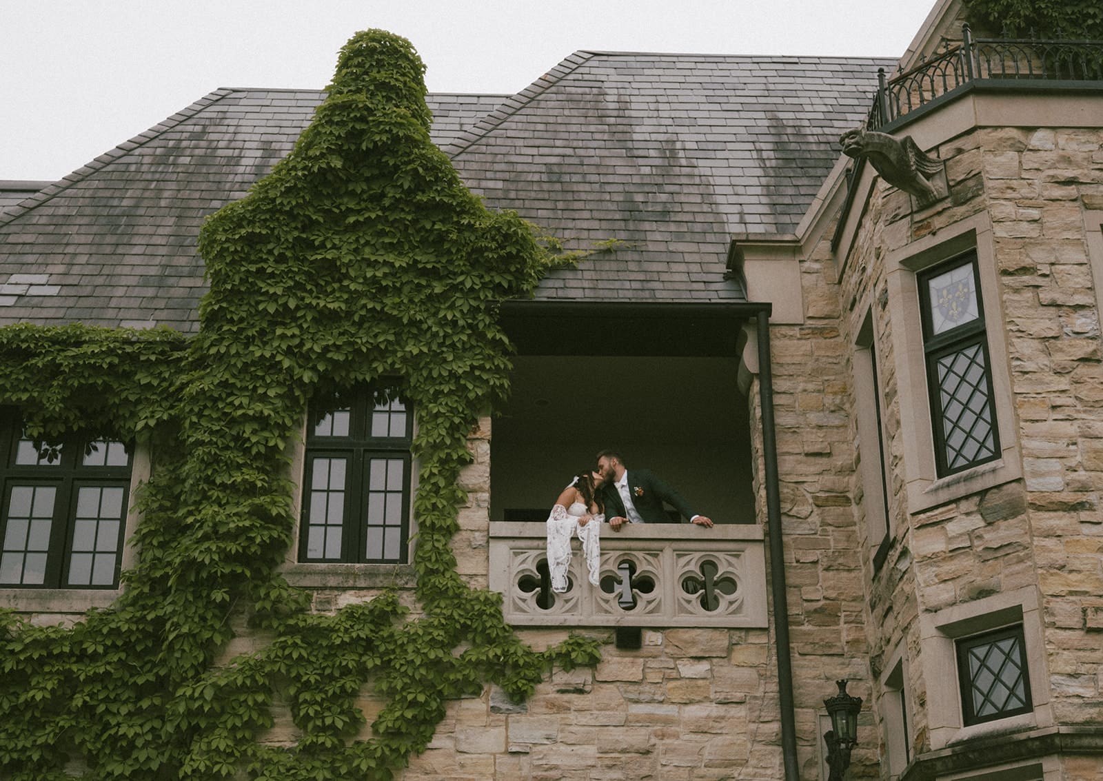 A bride and groom kissing in their castle Chicago wedding venue