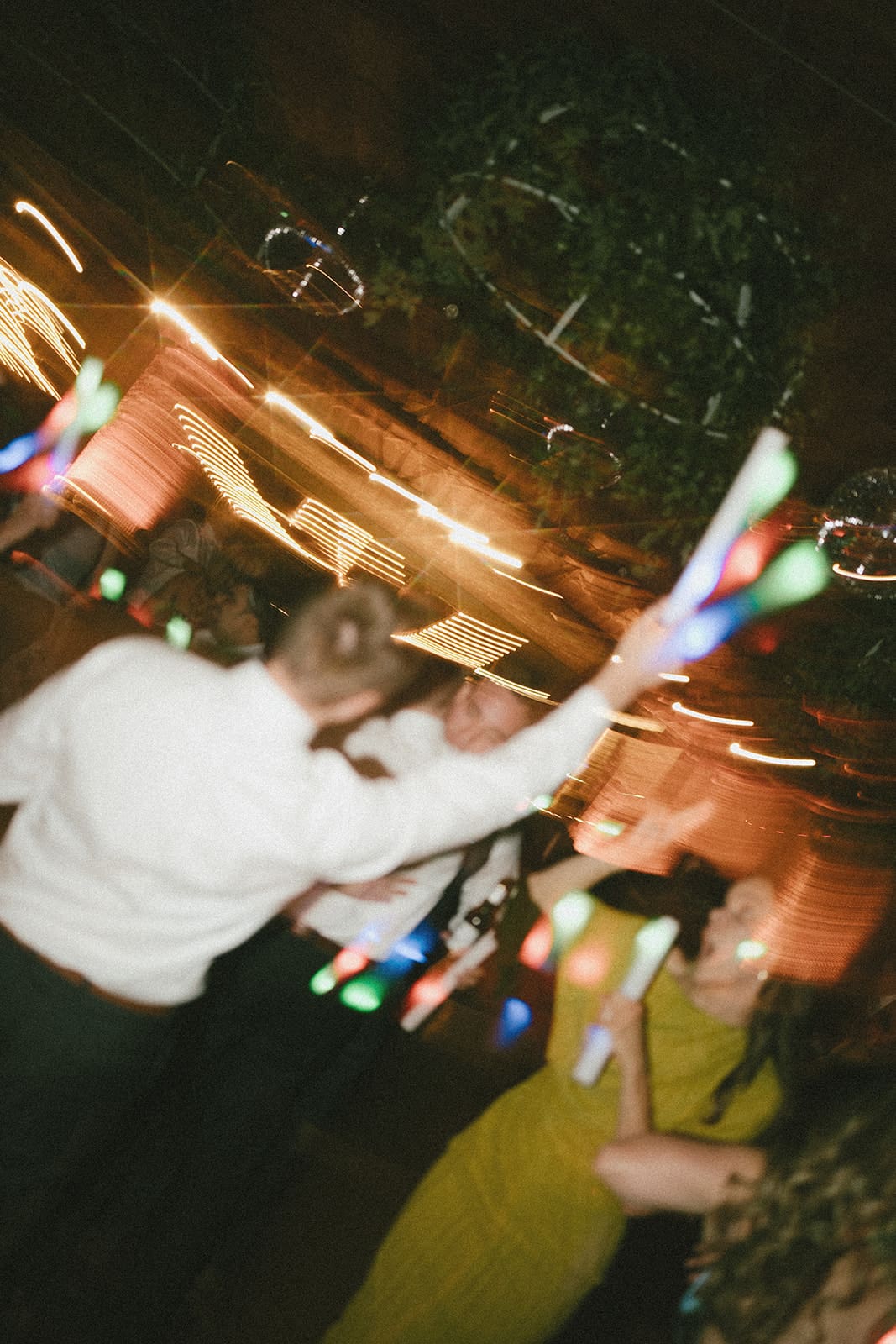 A candid wedding photo from a wedding reception dance floor