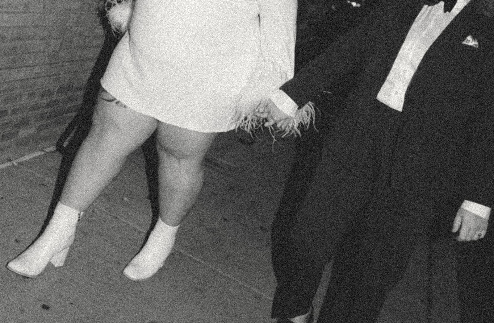 A wedding couple walking hand-in-hand during Chicago wedding photos