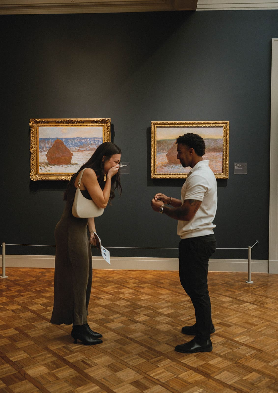 A couple during their art museum proposal
