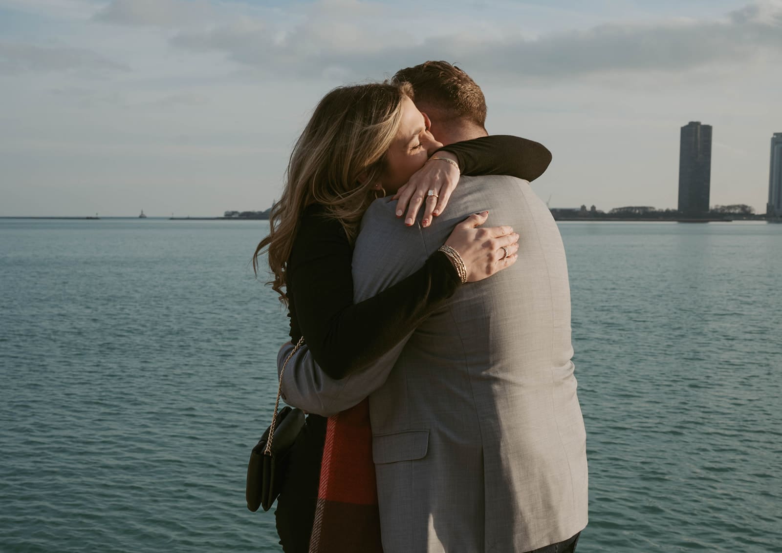A couple hugging after their Chicago proposal