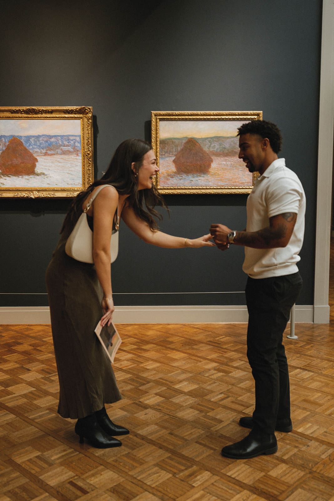 A couple during their art museum proposal