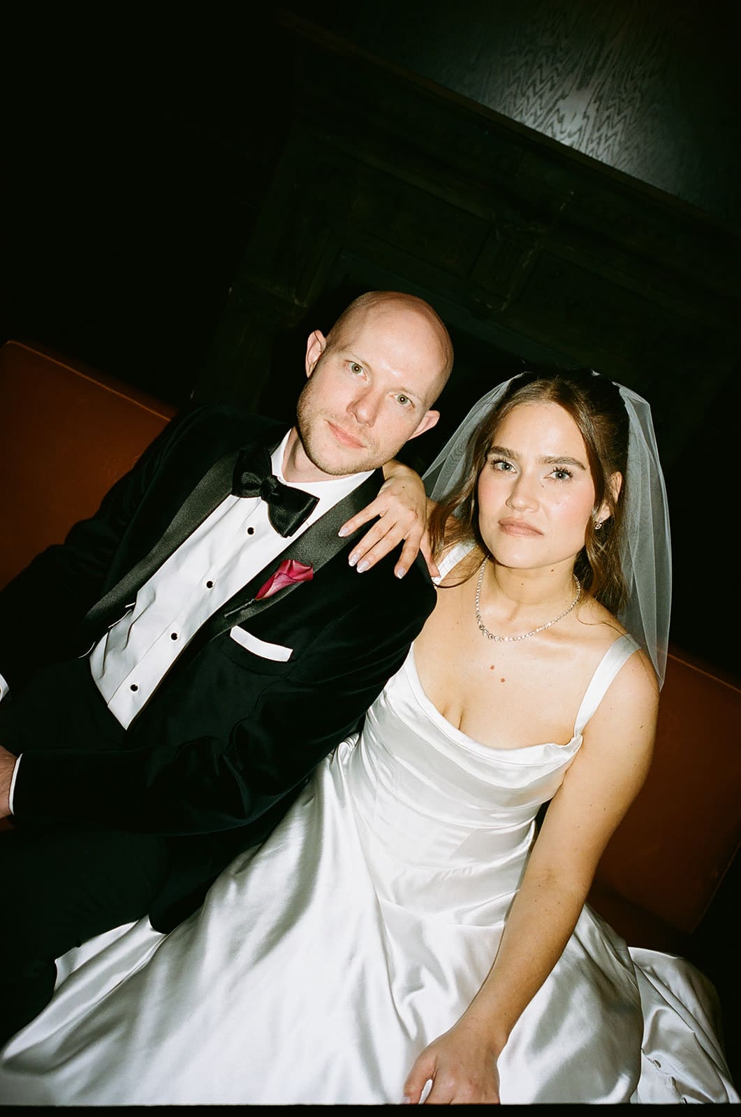 A bride and groom posing for editorial wedding photos