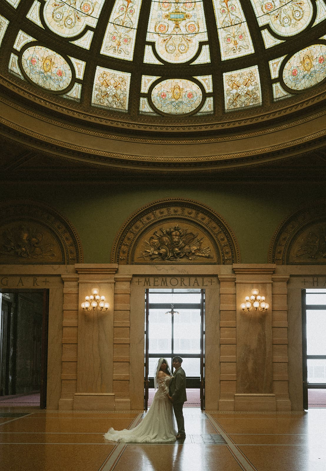 A bride and groom taking courthouse wedding photos