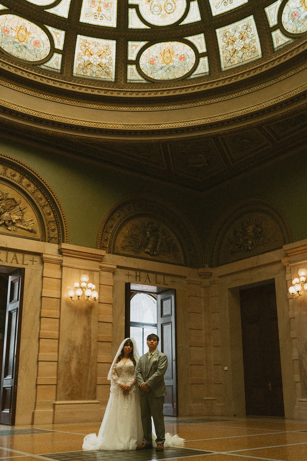 A bride and groom taking courthouse wedding photos