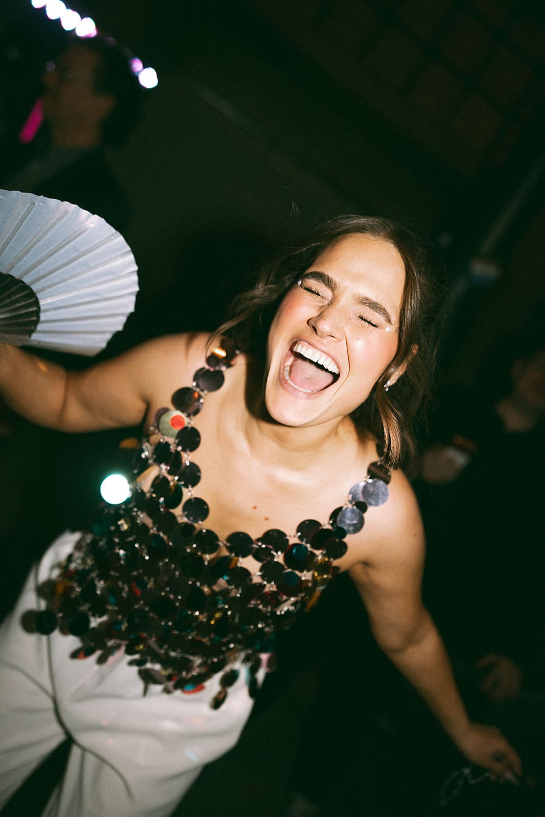 A bride's wedding reception outfit showing off 2027 wedding trends